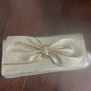 Gold St Johns clutch/shoulder bag/ cross body bag with bow detail on front
